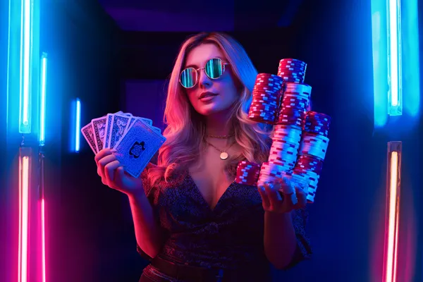 A glamorous woman holding casino chips in a neon-lit environment, representing the premium online casino atmosphere of CD33.